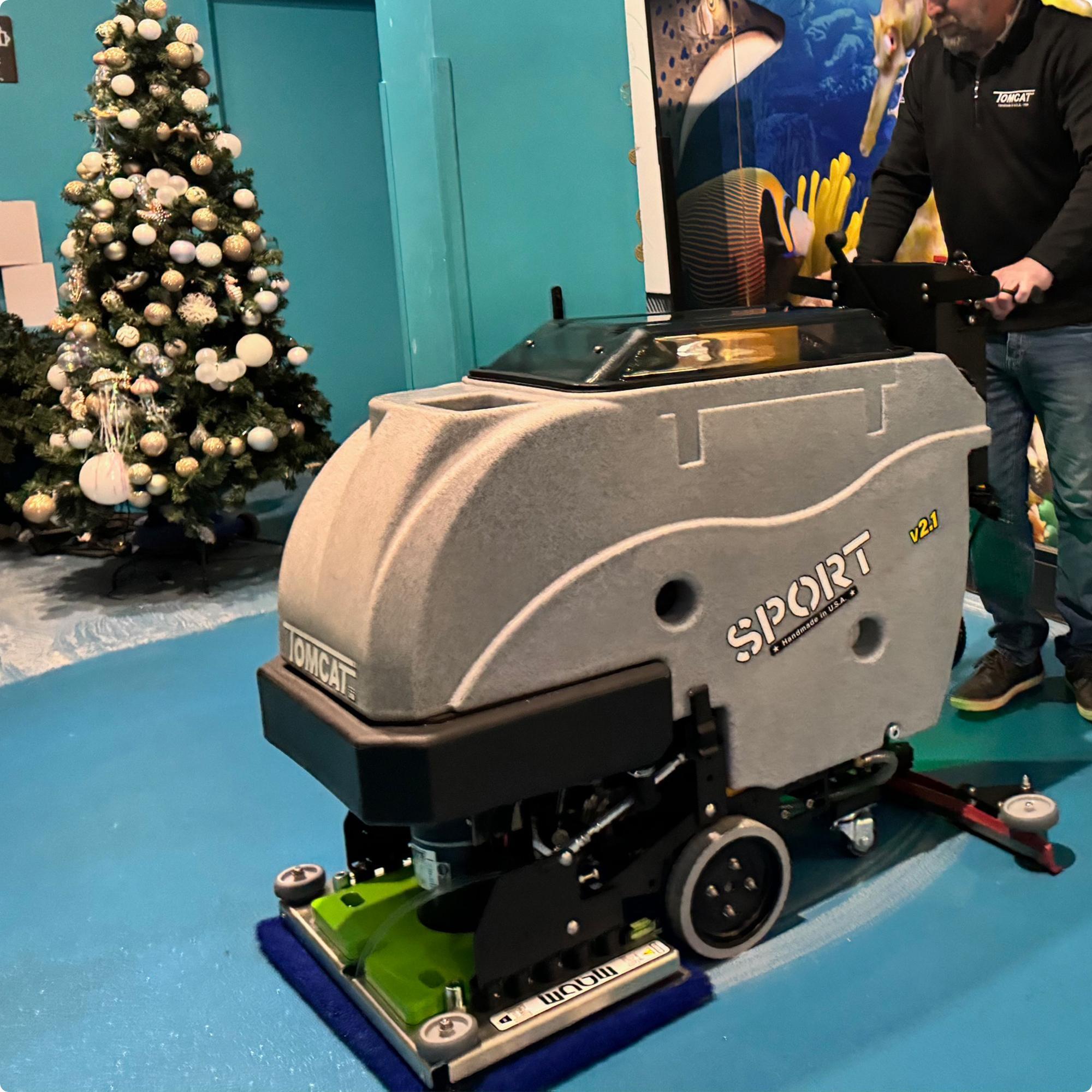 Tomcat Sport 24" EDGE Deck Walk Behind Floor Scrubber cleaning an epoxy floor in the lobby of an aquarium IMG00055