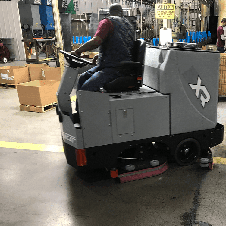 Tomcat floor scrubber showcasing its cleaning power