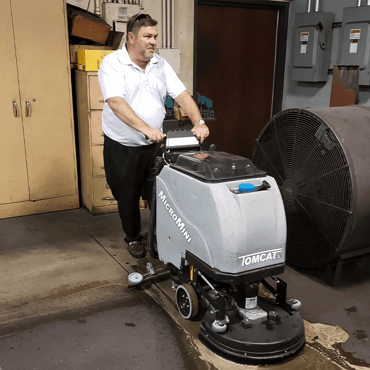 Tomcat floor scrubber showcasing its cleaning power