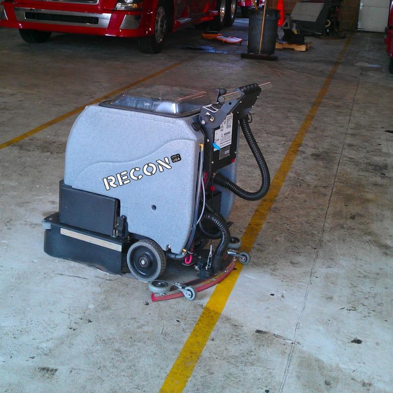 Tomcat Walk Behind Floor Scrubbers Recon service bay epoxy RECON Walk Behind Floor Scrubber cleans a filthy epoxy floor in a service bay of a Williamsburg, Virginia truck repair shop
