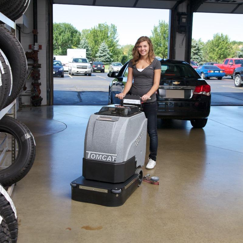 Tomcat Walk Behind Floor Scrubbers Recon service lane concrete Tomcat RECON battery Walk Behind Floor Scrubber cleaning the concrete service lane of a Detroit, Michigan auto dealers