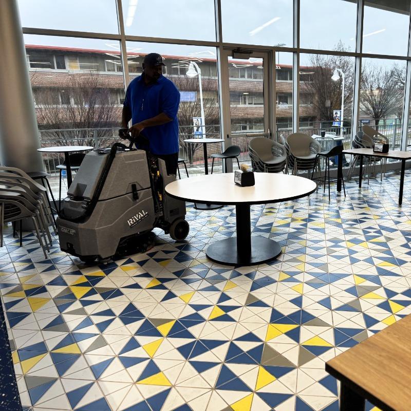 Tomcat Stand On Floor Scrubbers Rival café ceramic tile A Tomcat Rival stand on floor scrubber cleaning the ceramic tile floor of a café at a university in Lexington, KY