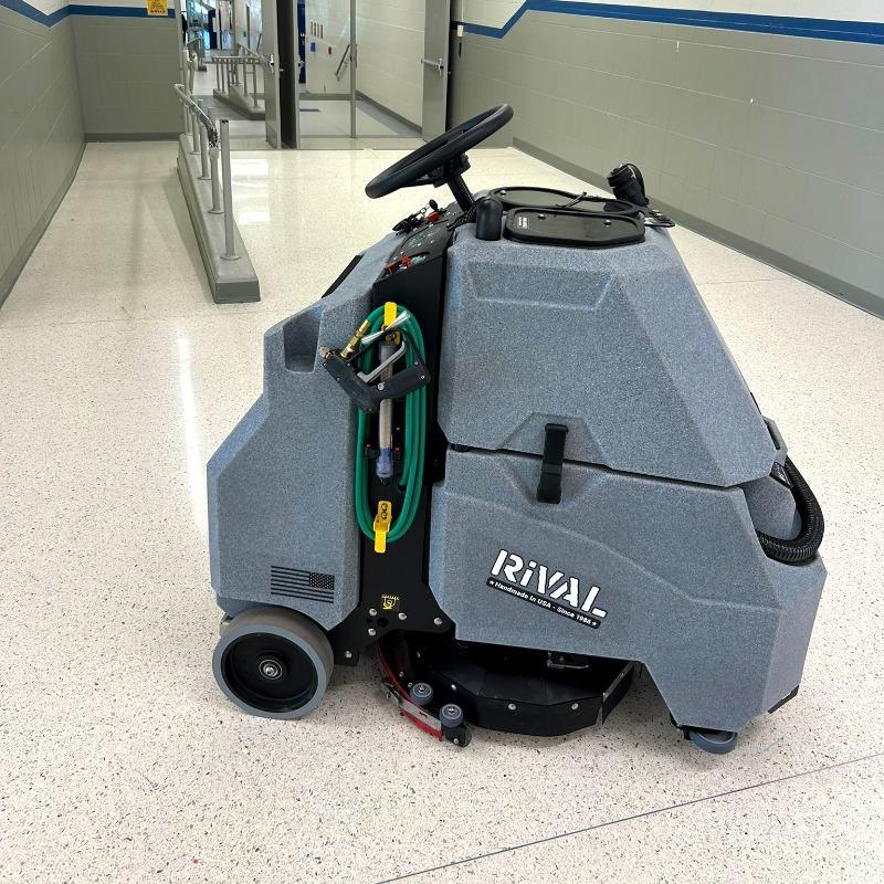 Tomcat Stand On Floor Scrubbers Rival hallways terrazzo A Tomcat Rival stand on battery floor scrubber cleaning the terrazzo floor of a hallway in , KY