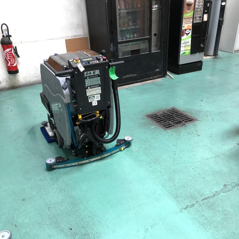 Tomcat Walk Behind Floor Scrubbers Sport aisles epoxy SPORT Battery Walk Behind Floor Scrubber cleaning the aisles at a carpet mill in North Carolina