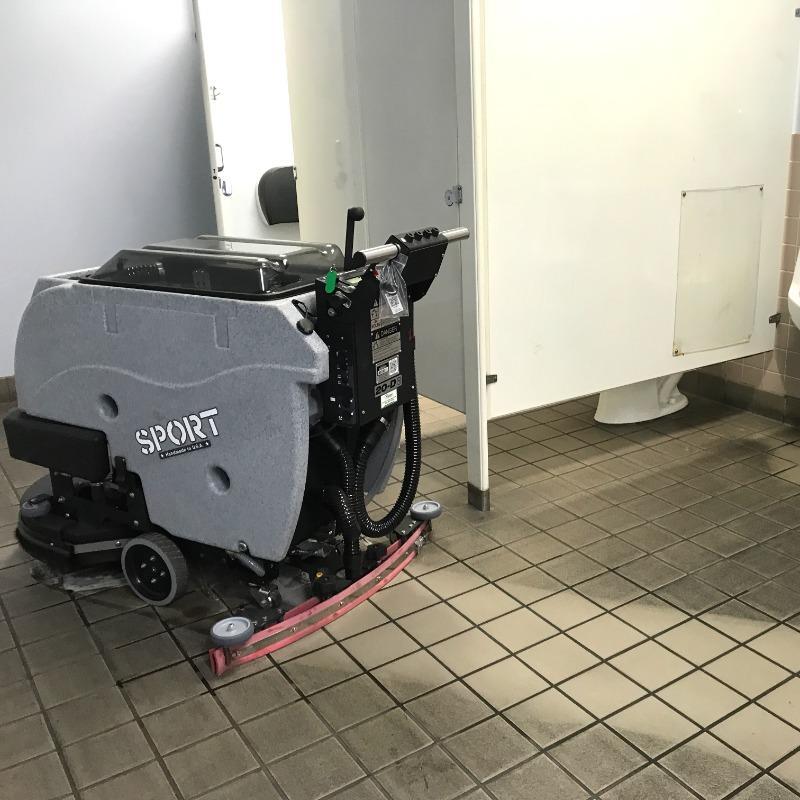 Tomcat Walk Behind Floor Scrubbers Sport bathroom tile floors SPORT Walk Behind battery Floor Scrubbers cleans the tile floor in the restroom of an Atlanta Georgia Fabrication Shop