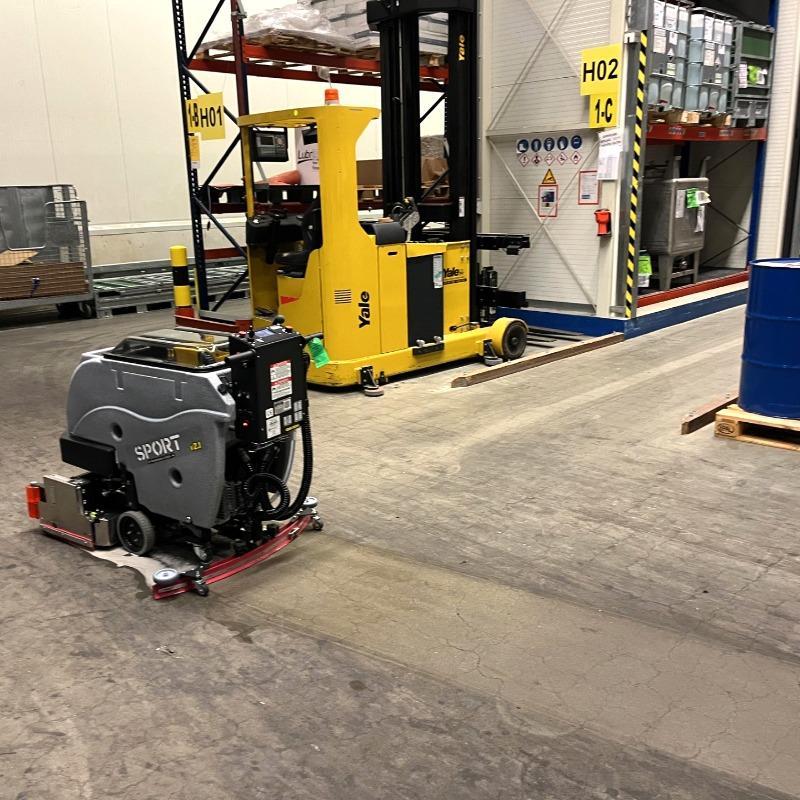 Tomcat Walk Behind Floor Scrubbers Sport warehouse concrete SPORT Walk Behind Floor Scrubbers cleaning the concrete floor in a Fabrication Shop