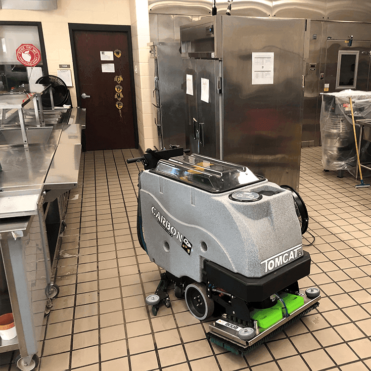 Tomcat floor scrubber showcasing its cleaning power